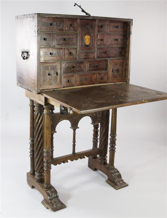 An 18th century and later Spanish walnut and iron mounted vargueno on stand, W.3ft 2in. H.4ft 9.5in.